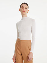 You can wear a white sweater with a white skirt.